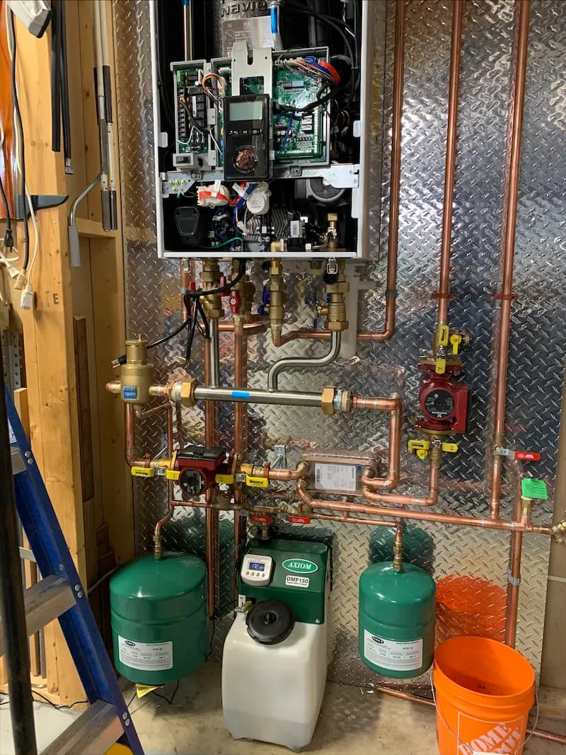 Wall-hung combi boiler supplying space heating and domestic hot water in a Calgary home