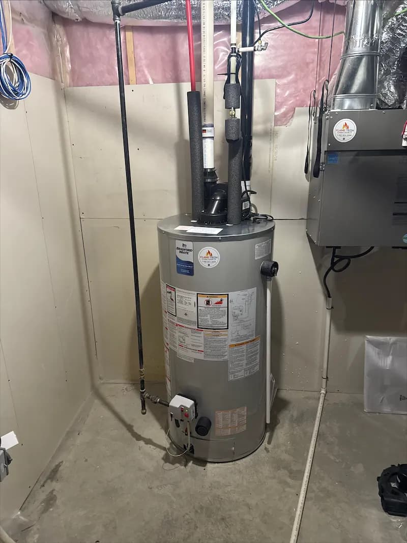 Bradford White power-vent hot water tank installed by FlameTech in a Calgary basement