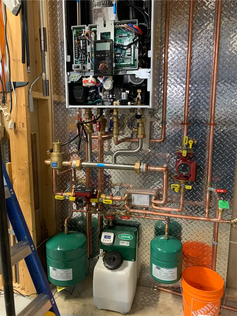 Wall-hung combi boiler supplying space heating and domestic hot water in a Calgary home