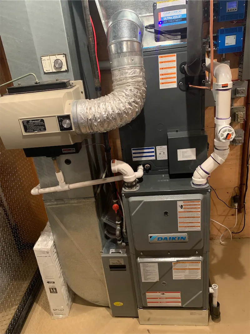 Daikin furnace with ductwork, condensate venting, and humidifier installed by FlameTech in Calgary